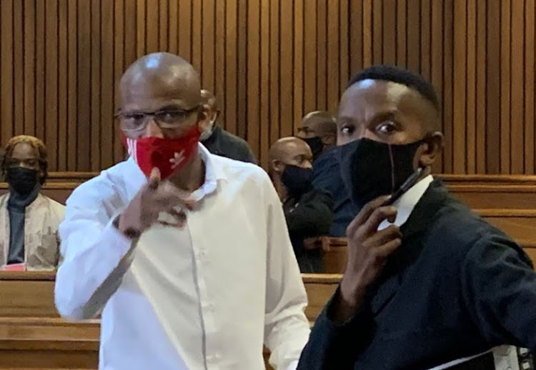 Convicted rapist Sello Abram Mapunya (in white shirt) in the Pretoria high court along with his lawyer Walter Rankapole. Judge Papi Mosopa sentenced Mapunya in total to 1,088 years' imprisonment.