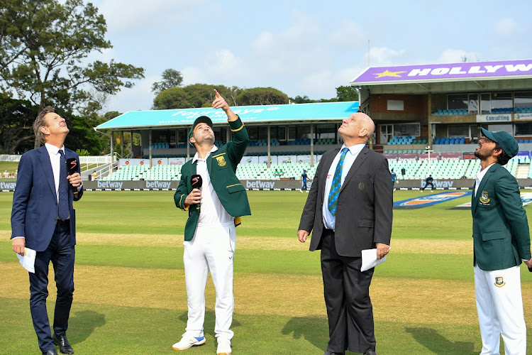 SA captain Dean Elgar and Bangladesh counterpart Mominul Haque conduct the coin toss on day one of the first Test at Kingsmead Stadium in Durban on March 31 2022.