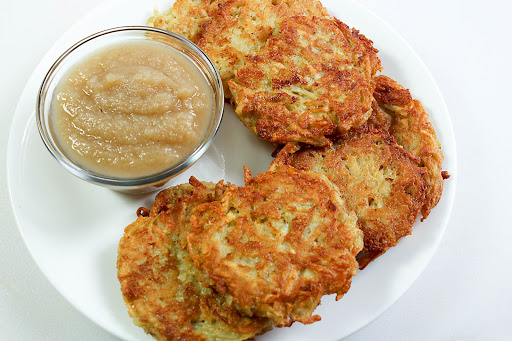 Quinoa and potato latkes with a side of applesauce.