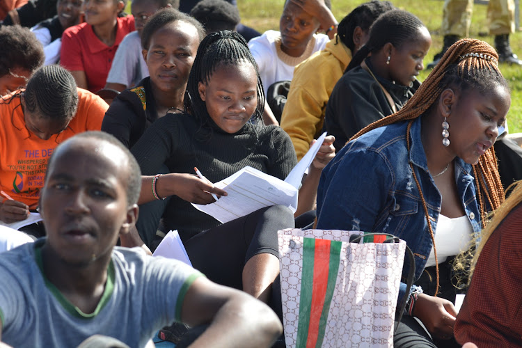 Youth Kenyans wait for examination of academic qualifications during selection to join Kenya Wildlife Services as rangers and assistant wardens on April 15, 2024.