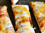 Cheesy Garlic Pizza Sticks Recipe was pinched from <a href="http://addapinch.com/cooking/2013/09/20/cheesy-garlic-pizza-sticks-recipe/" target="_blank">addapinch.com.</a>