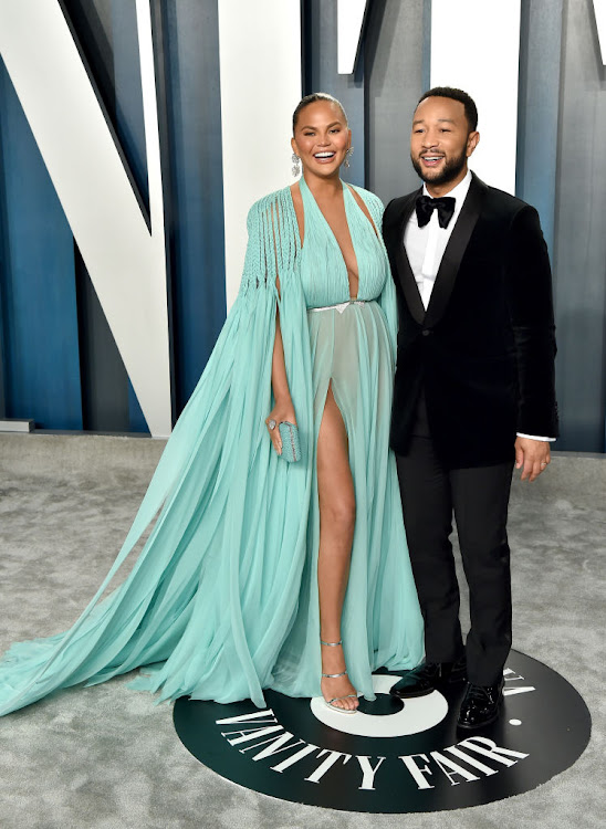 Model Chrissy Teigen and her husband, John Legend - People magazine's Sexiest Man Alive - at the 2020 Vanity Fair Oscar party.