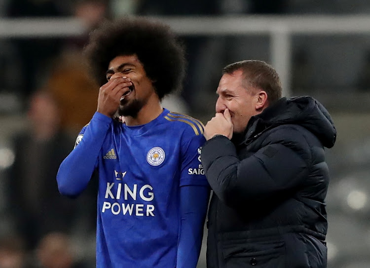 Leicester City manager Brendan Rodgers shares a joke with Hamza Choudhury