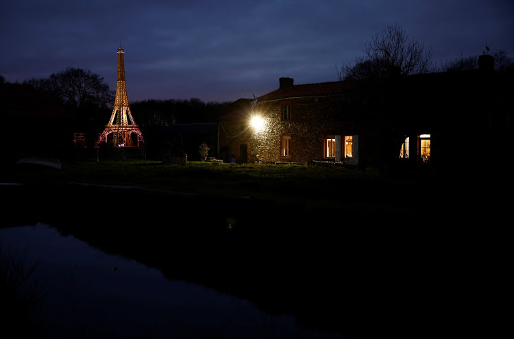 View of a 16-meter replica of the Eiffel Tower from recycled wood built by French carpenter Frederic Malmezac and Sylvain Bouchard, a sports enthusiast with disability.