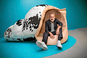 Artist Porky Hefer takes a load off in one of his whimsical seats.