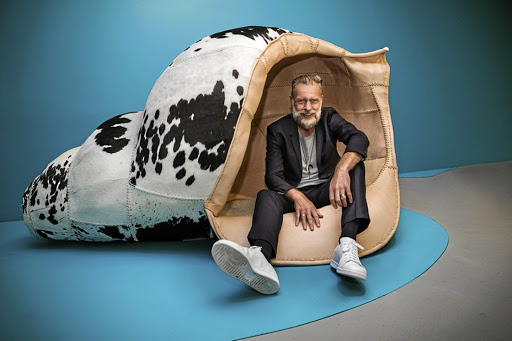 Artist Porky Hefer takes a load off in one of his whimsical seats.