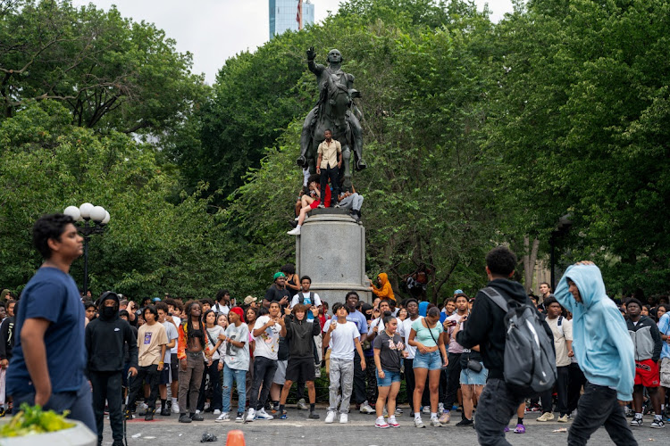 People gather after popular live streamer Kai Cenat announced a "giveaway" event that grew chaotic, prompting police officers to respond and disperse the crowd at Union Square and the surrounding streets, in New York City, US August 4, 2023.