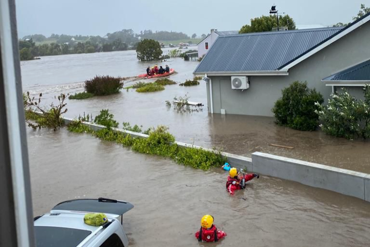 Rescue workers help stranded flood victims to safety after parts of the riverside village of Stanford were flooded recently. Picture: RUBY WALNE.