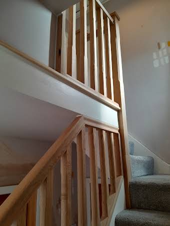 Stair case and banisters spindles /glass panels album cover