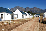 David and Elaine Potter have built a R30m architect-designed village for the workers on their farm in the Cape winelands, and transferred title to them.