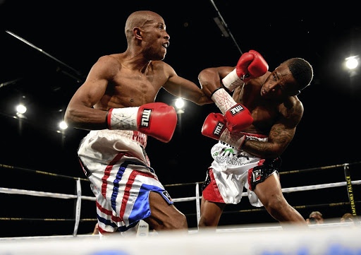 Michael Mokoena, left, in action with Lusanda Komanisi could fight for the vacant SA title. /Johan Rynners/Gallo Images