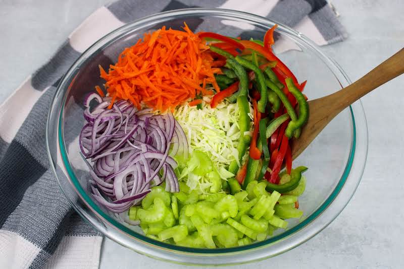 Vegetables Added To A Bowl.