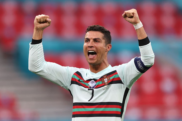 Cristiano Ronaldo of Portugal celebrates after victory in the UEFA Euro 2020 Championship Group F match against Hungary at Puskas Arena in Budapest, Hungary, on Tuesday.