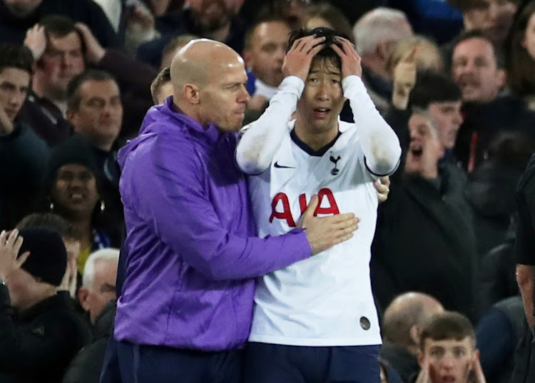 Tottenham Hotspur's Son Heung-min looks dejected after Everton's Andre Gomes sustains an injury