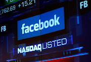 Monitors display the Facebook Inc stock during morning trading at the Nasdaq market site in New York, US. (File photo)