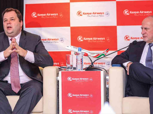 Former Kenya Airways CEO Sebastian Mikosz makes a point as chairman Michael Joseph looks on during the announcement of Kenya Airways financial results at Crowne Hotel, Nairobi on March 21,2018. / VICTOR IMBOTO