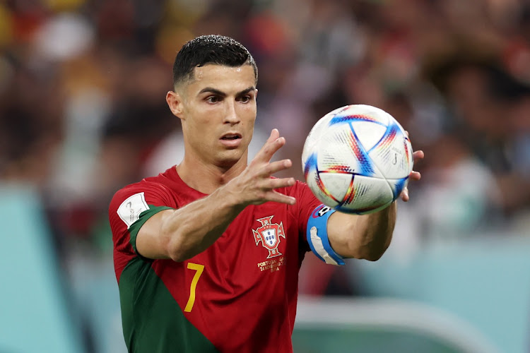 Cristiano Ronaldo of Portugal catches the ball during the FIFA World Cup Qatar 2022 Group H match between Portugal and Ghana at Stadium 974 on November 24, 2022 in Doha, Qatar.