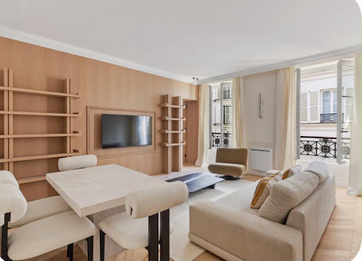Prestige apartment / penthouse for sale in Paris 7ème (75007) - Neighborhood Invalides - Modern living room with sofa, table, wooden shelves
