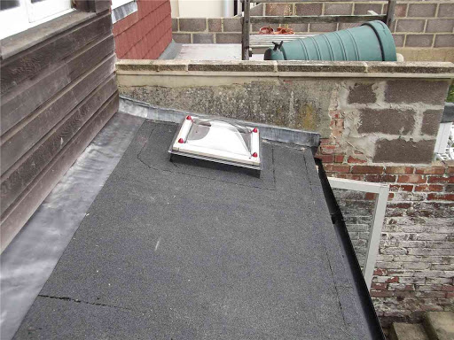 Complete replacement of flat roof including two roof lights, insulation, gutters etc.