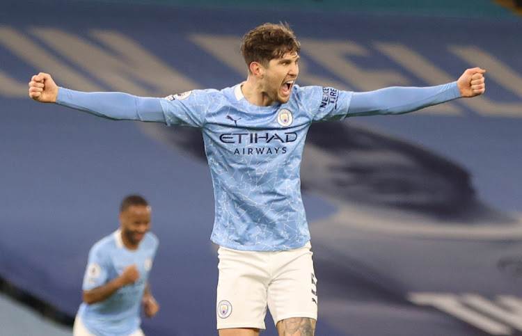 Manchester City's John Stones celebrates scoring their third goal.