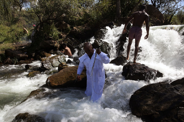 Bishop Bongile Ndlotseni getting a cleansing ahead of Easter in Klip River catchment.