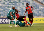 Samu Friday Maritzburg United is tackled by Abbubaker Mobara of AmaZulu FC.