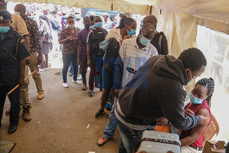 Ongoing public vaccination program conducted by NMS in partnership with WHO and PS Kenya near Bus Station Nairobi on Friday, December 17, 2021. PHOTO/WILFRED NYANGARESI