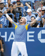 Lleyton Hewitt of Australia celebrates his victory over Evgeny Donskoy of Russia in the fourth round of the US Open in New York on Sunday