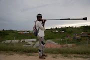 A young man blows a vuvuzela as they walk to eKhenani mountain in Ozwathini, KwaZulu Natal, where the annual holy pilgrimage is held. The pilgrimage started on Tuesday and ends on January 23. 