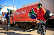 A woman arrives to collect groceries from a Malaicha warehouse during a nationwide lockdown to help curb the spread of the coronavirus disease (COVID-19) in Harare, Zimbabwe, May 15, 2020. File photo 