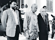 ANC Secretary General Cyril Ramaphosa, President Nelson Mandela, then Deputy President FW de Klerk and Gauteng Provincial leader Roelf Meyer speak to the press after a meeting about the constitution in April 1996.