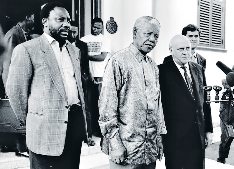 ANC Secretary General Cyril Ramaphosa, President Nelson Mandela, then Deputy President FW de Klerk and Gauteng Provincial leader Roelf Meyer speak to the press after a meeting about the constitution in April 1996.