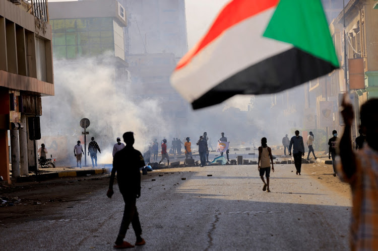 People march to the presidential palace, protesting against military rule following last month's coup in Khartoum, Sudan December 19 2021. Picture: REUTERS/MOHAMED NURELDIN ABDALLAH