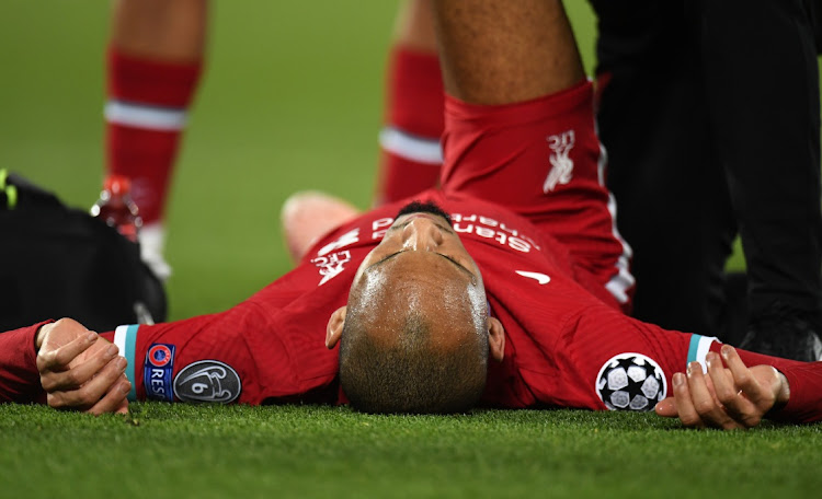 Fabinho of Liverpool after sustaining an injury during the UEFA Champions League Group D stage match against Midtjylland at Anfield on October 27, 2020 in Liverpool