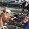 Thumbnail For The Guys Cleaning Bass. They Used And Electric Knife To Fillet The Fish.