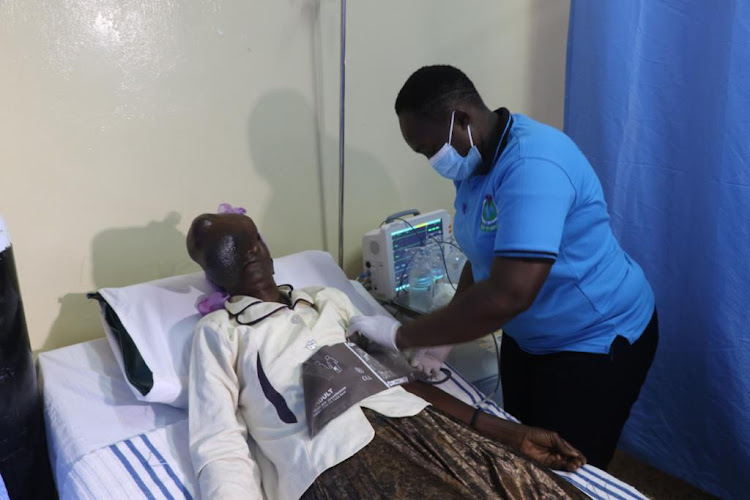 A nurse prepares Beatrice Makokha for her tests at the Bungoma Level 5 Hospital on Sunday.