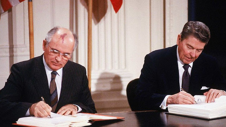 Ronald Reagan and Mikhail Gorbachev signing the Intermediate-Range Nuclear Forces Treaty in 1987.