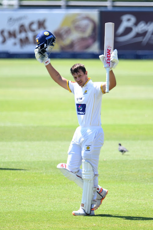 The Lions' Delano Potgieter acknowledges the applause from his teammates after completing his century on the penultimate day of the Four-Day Series final at the Wanderers on Saturday