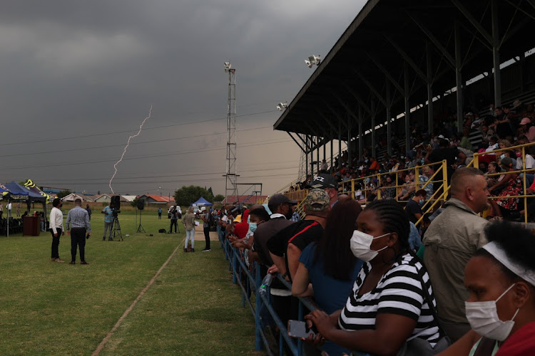 A lightning bolt hits as parents gather for a meeting with Gauteng Education MEC Penaza Lesufi, 17 February 2022, at Hoërskool Jan Viljoen, west of Johannesburg, on Thursday.