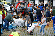 People gather sand bags following heavy rainfalls in Erftstadt, Germany, July 16, 2021. 
