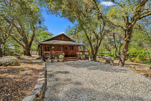 Wooden house with porch surrounded by trees - Property purchase in Somerset, 2 bedrooms