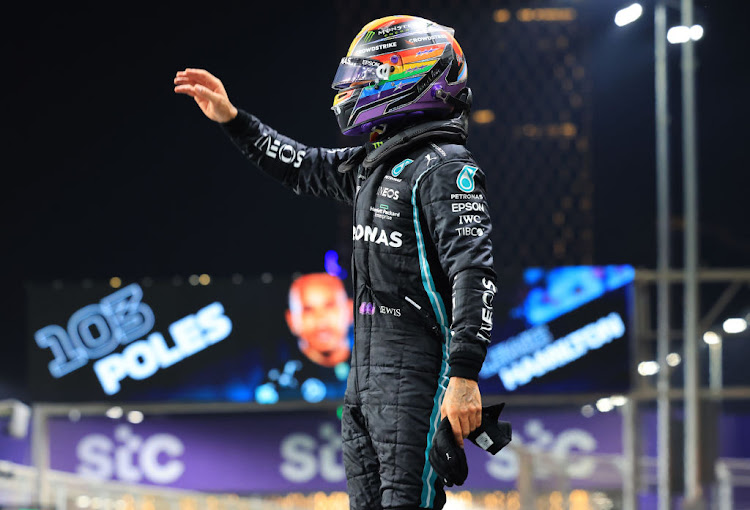 Pole position qualifier Lewis Hamilton celebrates in parc ferme during qualifying ahead of the F1 Grand Prix of Saudi Arabia at Jeddah Corniche Circuit on December 04, 2021 in Jeddah, Saudi Arabia.