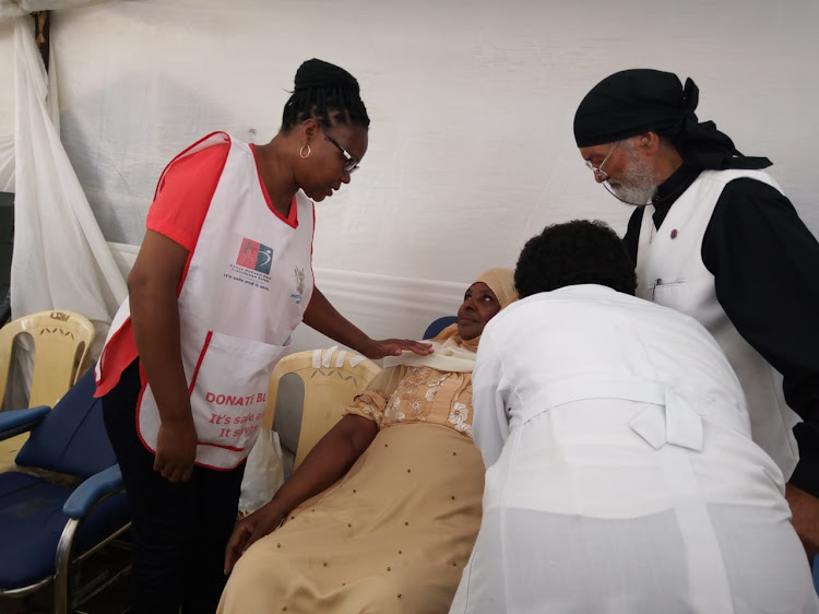 Kenya highest female blood donor Aisha Dafalla donates blood during the ongoing interfaith blood donation drive in Landimawe in Nairobi on Saturday March 7, 2020