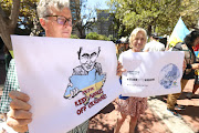 A group of Ukrainian citizens protest outside the Russian embassy in Cape Town on February 25 2022. They are calling for a stop to Russia's incursion into Ukraine. 