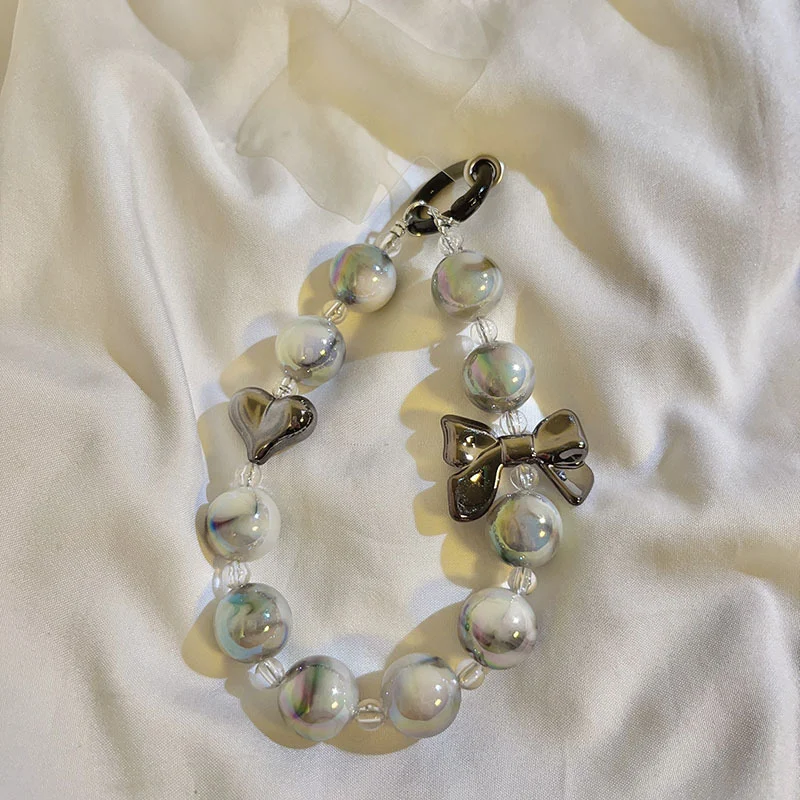 Porte-clés Pendentif Marbre Love Bow Un accessoire élégant et romantique pour vos clés. Le cadeau idéal pour exprimer votre amour avec style.
