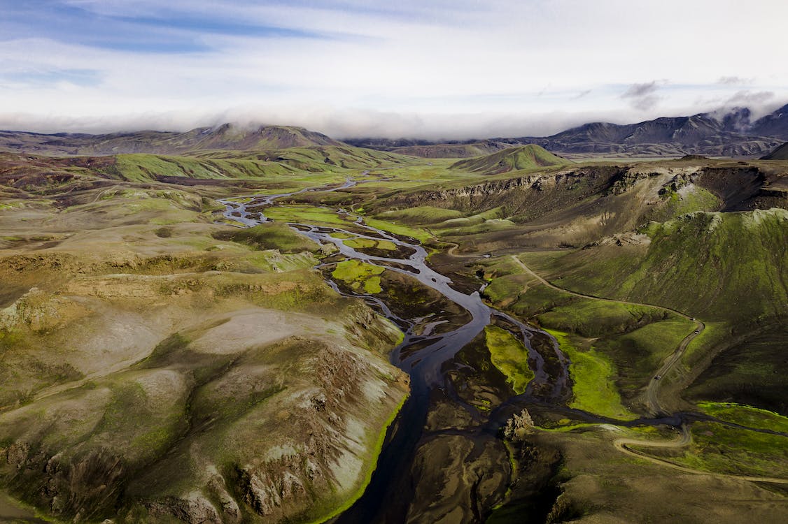 Free Green Grass Field and River Stock Photo