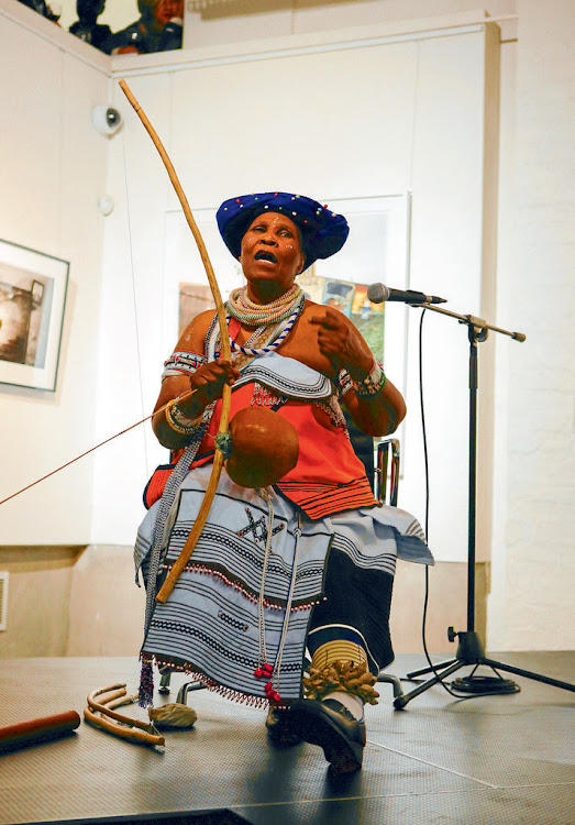 Subtle sound: Traditional musician Madosini plays the uhadi at an event at the Wits Art Gallery . Picture: SUPPLIED