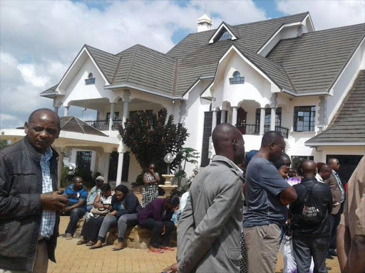 Mourners at the home of Thika businesswoman Joyce Wambui who was murdered on Monday, February 27, 2017. /JOHN KAMAU