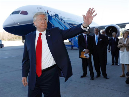 US President Donald Trump waves after speaking at the debut of the Boeing South Carolina Boeing 787-10 Dreamliner in North Charleston, South Carolina, US, February 17, 2017. /REUTERS