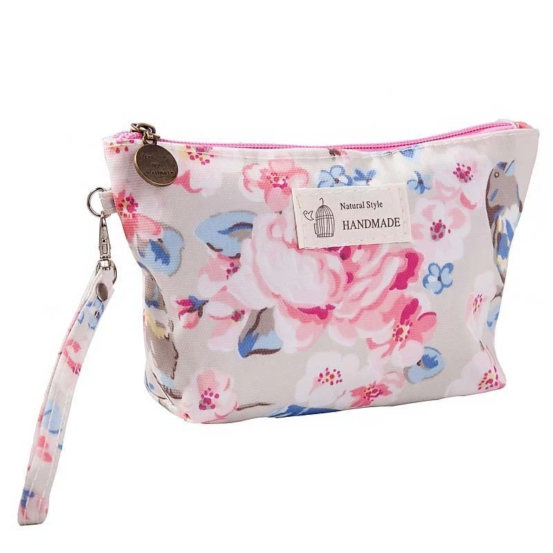 Trousse de maquillage portable en tissu imprimé imperméable pour femmes, avec fermeture éclair et lavage à la main, idéale pour voyager.